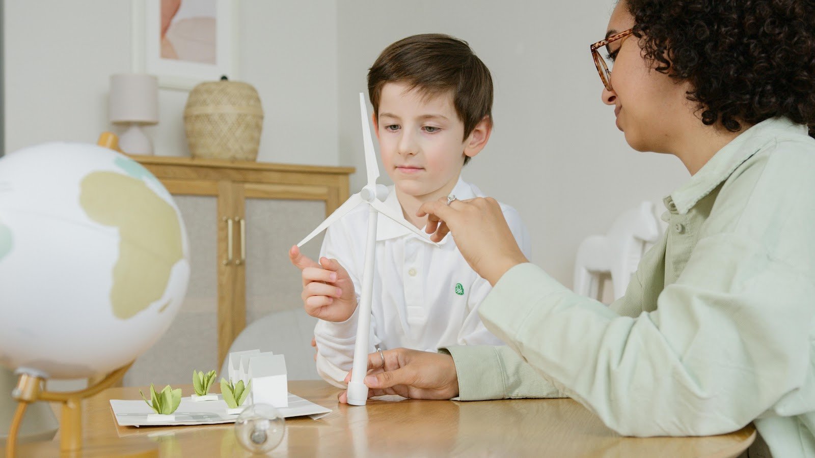 Homeschooling sustainability education: children learning about clean energy solutions 